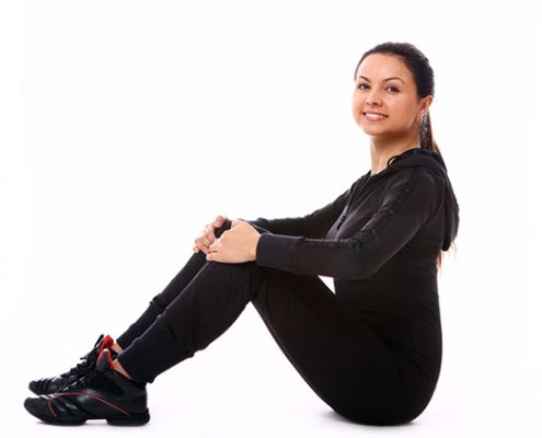 Young woman doing fitness exercises